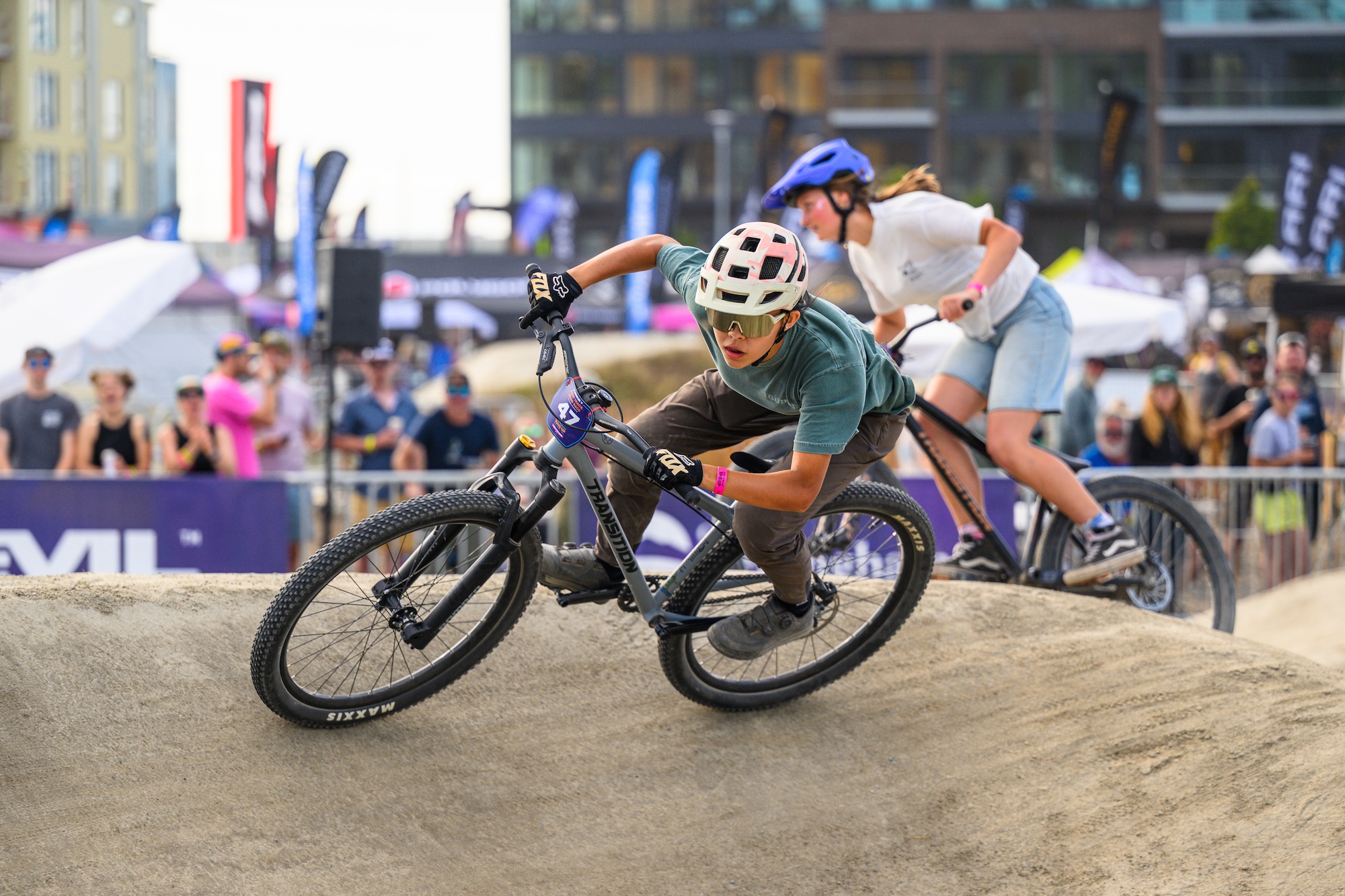 Two racers go head to head in the pump track race.